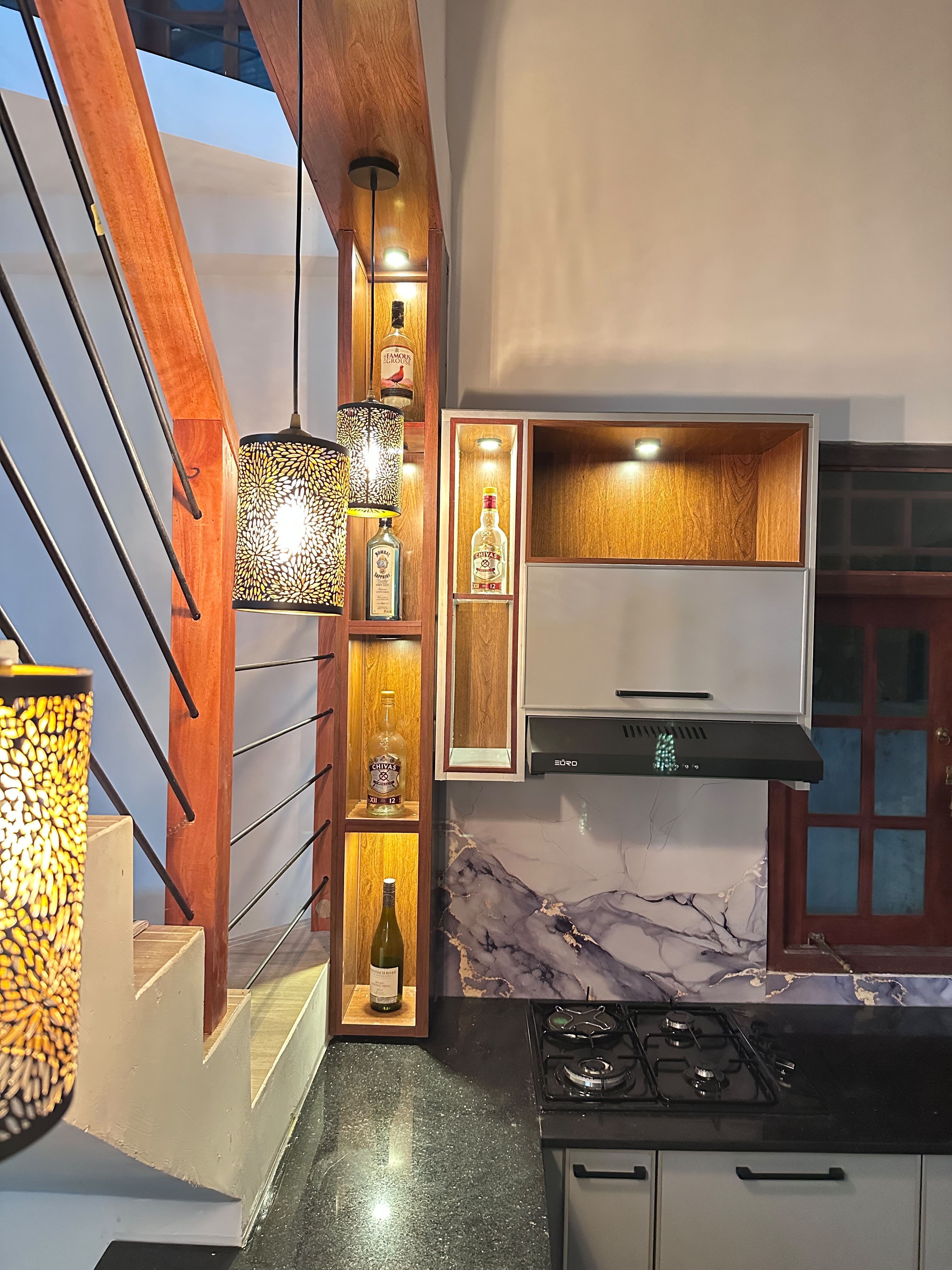 Kitchen with wooden display shelves and liquor cabinet